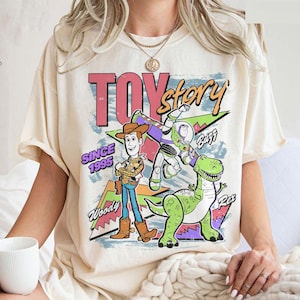 May include: A set of three ceramic mugs with a speckled, matte finish. Each mug features a different color: light blue, cream, and gray. The mugs have a simple, modern design and a comfortable handle.