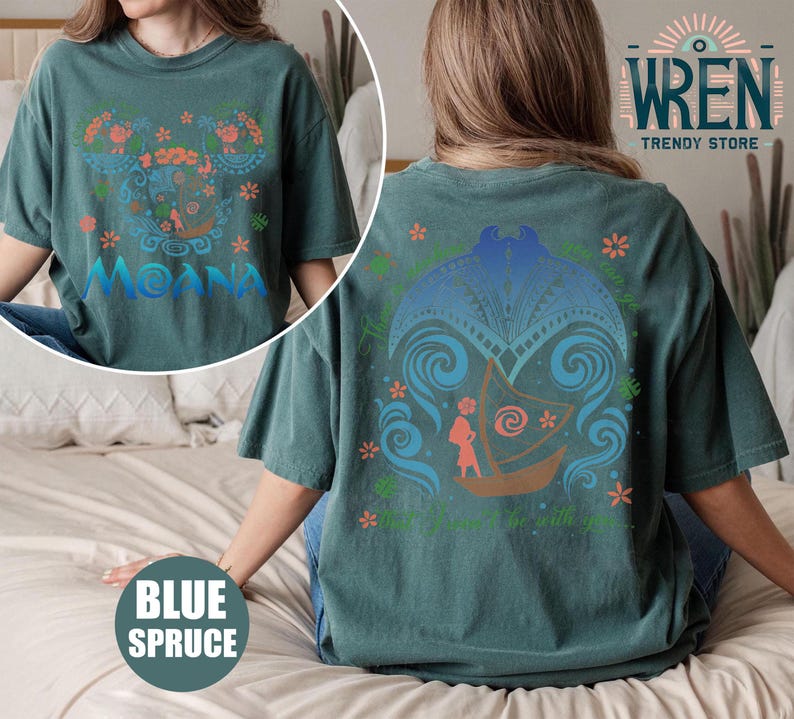 May include: A teal blue t-shirt with a graphic print of Moana from the Disney movie Moana. The front of the shirt features a colorful design with Moana's name and the back of the shirt features a design of Moana sailing on a boat with the text "The ocean chose you to be with you".