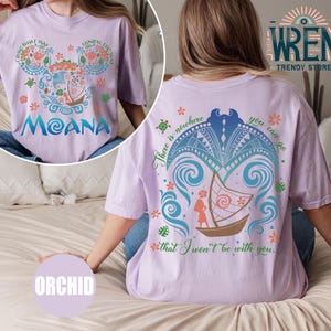 May include: A purple t-shirt with a graphic design of a cartoon character from the movie Moana. The design includes a boat, a turtle, and the text "There is nowhere you can go that I won't be with you."