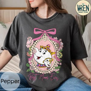 May include: A gray t-shirt with a pink floral design and a cartoon image of Belle and the Beast from Beauty and the Beast. The text "Best Mom Ever" is printed below the image.