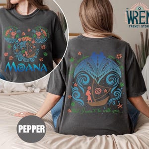 May include: A black t-shirt with a graphic of Moana's boat on the back and a graphic of Moana's face on the front. The text "Moana" is printed on the front of the shirt. The text "There is nowhere you can go that I won't be with you..." is printed on the back of the shirt.