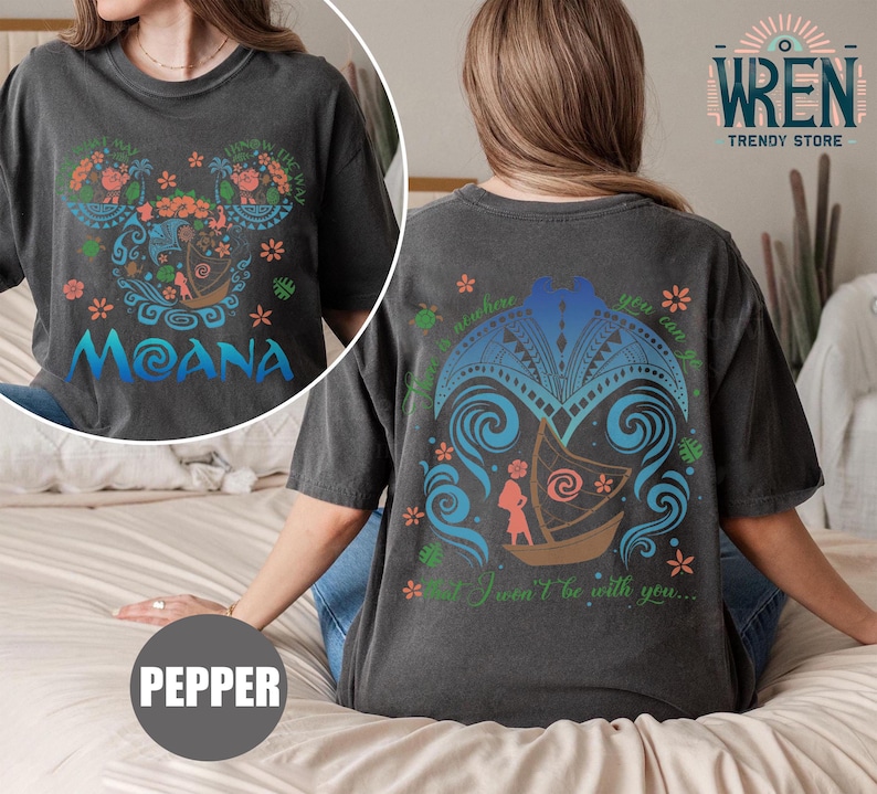 May include: A black t-shirt with a graphic of Moana's boat on the back and a graphic of Moana's face on the front. The text "Moana" is printed on the front of the shirt. The text "There is nowhere you can go that I won't be with you..." is printed on the back of the shirt.