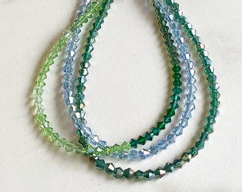 LOT of 3 strands of Swarovski Crystal BiCone Orphan beads in shades of green and blue