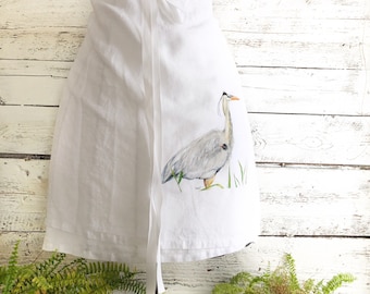 Linen Cafe Apron with blue heron in marsh watercolor art for serving in style. Machine washable. One size fits all. Unique bird lover gift.