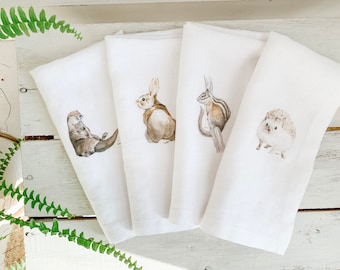 Set of four French Linen Napkins with beautiful Canadian water colour artwork, 18 inch square, otter, bunny, chipmunk, hedgehog