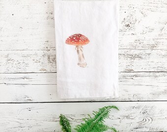 French linen tea towel with watercolor mushroom art.  Machine washable large size absorbent gift for mushroomcore theme. Amanita muscari.a.