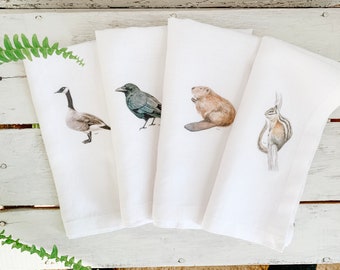 Set of four French Linen Napkins with beautiful water colour artwork, 18 inch square, Canada goose, black crow, chipmunk, beaver