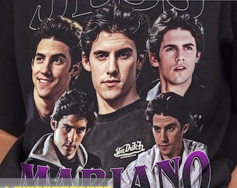 May include: Black t-shirt with a purple and white graphic print of four men's faces and the text "JESS MARIANO".