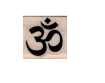 May include: Black and white Om symbol, a sacred Hindu mantra, on a wooden background.