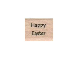 May include: A wooden stamp with the text "Happy Easter" in black ink.