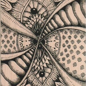 May include: A black and white intricate design with a repeating pattern of circles and lines. The design is symmetrical and has a central point.