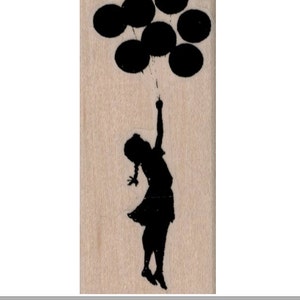 May include: A black silhouette of a person holding onto a bunch of black balloons.