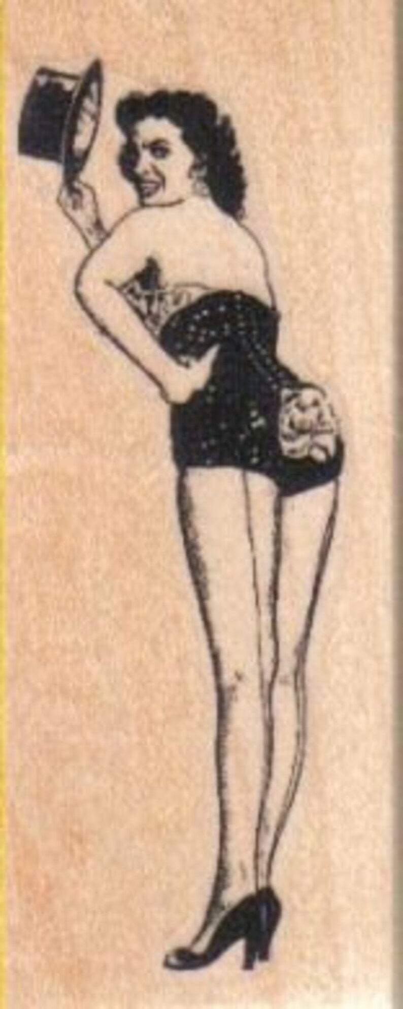 May include: A black and white illustration of a woman wearing a black and white polka dot dress and a top hat. She is holding the hat in her hand and looking over her shoulder.