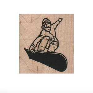 May include: Black and white illustration of a snowboarder wearing a hat and goggles, riding a snowboard.
