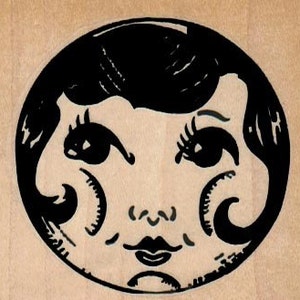 May include: Black and white illustration of a stylized face with large eyes and a short bob hairstyle. The face is framed in a circle.