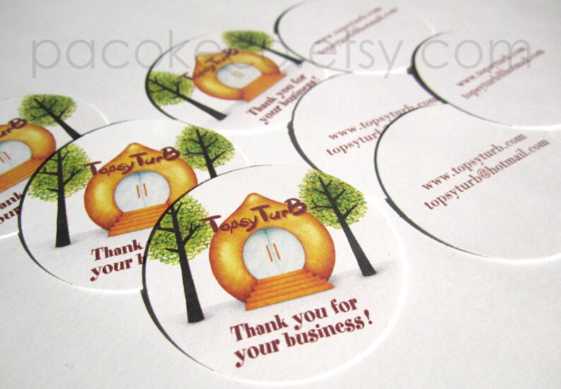 May include: Circular stickers with a whimsical design featuring a stylized house with a door, stairs, and trees. The text "Topsy TurB" and "Thank you for your business!" are printed on the stickers. Website and email address are also printed.