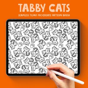 May include: A digital tablet shows a black and white pattern of cartoon tabby cats and paw prints. The text "TABBY CATS" and "SEAMLESS TILING PROCREATE PATTERN BRUSH" are at the top. A hand holds a white stylus, ready to draw.
