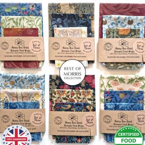 May include: A collection of six sets of three patterned beeswax food wraps. Each set is wrapped with a brown paper band that reads "Honey Bee Good Beeswax Food Wraps". The wraps feature floral and botanical designs in various colors. The text "Best of Morris Collection" is also visible.