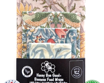 Może przedstawiać: Trzy woskowijki z motywami kwiatów i ptaków w odcieniach różu, zieleni i błękitu. Opakowanie zawiera tekst 100% HANDMADE IN THE UK, Honey Bee Good Beeswax Food Wraps, 100% Cotton, Award-Winning, Pine Resin-Free oraz THE REUSABLE REPLACEMENT FOR PLASTIC WRAP!