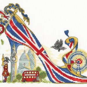 May include: A high-heeled shoe with a Union Jack design. The shoe is decorated with a London bus, Big Ben, and a double-decker bus. The shoe is surrounded by birds and a green plant.