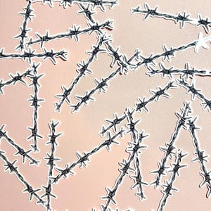 May include: A collection of individual die-cut stickers featuring a black and white illustration of barbed wire. Each sticker depicts a segment of twisted metal wire with sharp, pointed barbs arranged in a repeating pattern along the length.