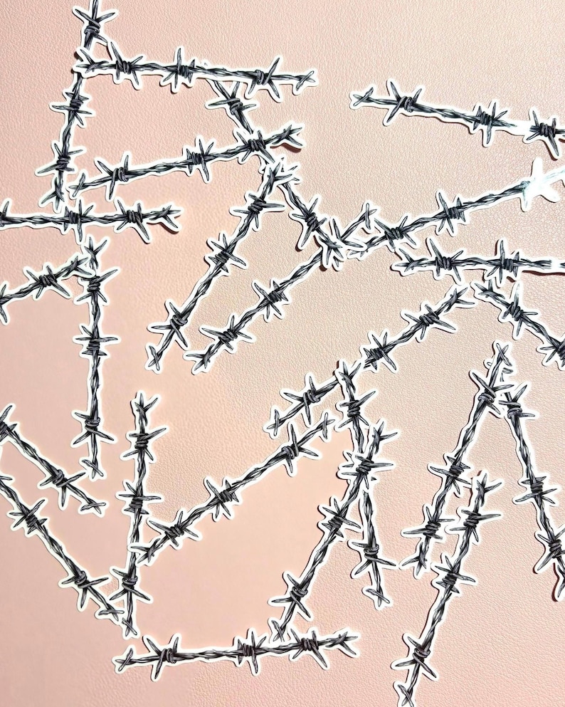 May include: A collection of individual die-cut stickers featuring a black and white illustration of barbed wire. Each sticker depicts a segment of twisted metal wire with sharp, pointed barbs arranged in a repeating pattern along the length.
