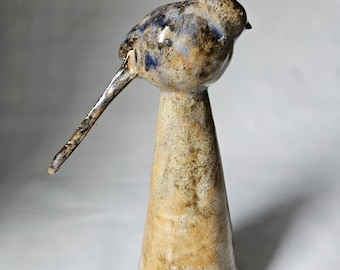 Long tailed tit ceramic sculpture.