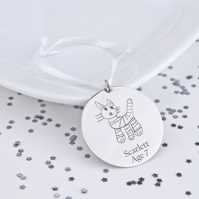 This 1 1/4 inch stainless steel disc is custom engraved with YOUR child's actual artwork.  Comes with white ribbon for hanging.