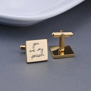 gold square cufflinks with handwritten message and showing the back of the cufflink as well.