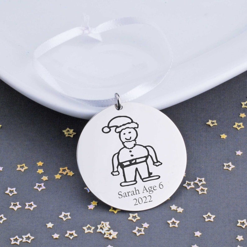 This 1 1/4 inch stainless steel disc is custom engraved with YOUR child's actual artwork.