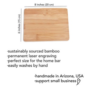 May include: A rectangular bamboo cutting board with a natural wood grain finish. It measures 8 inches by 6 inches (20 cm by 15 cm). The board is made from sustainably sourced bamboo and is perfect for use in the home bar. It is laser engraved with the text "support small business".