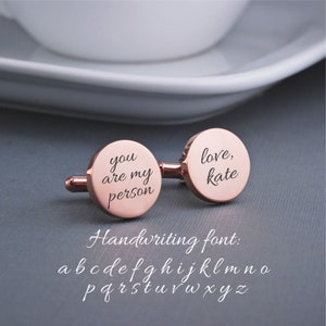 round rose gold cufflinks showing message in a font you are my person on one and love, kate on the other.