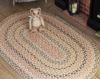 Dolls House braided rug in pink grey tone 12th scale