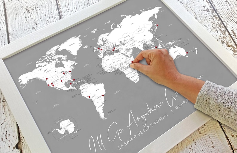 Personalized world travel map for pinning places you've been. Includes a travel quote with a couple's names, a family, or individual. This modern minimalist design is gray and white, or order in dusty blue, navy blue, sky blue, or taupe.