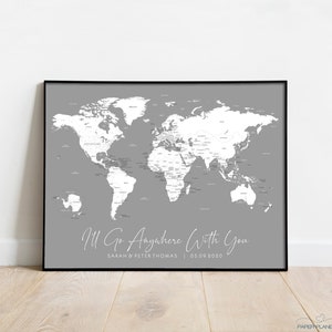May include: A grey world map print with white countries and text that reads "I'll Go Anywhere With You" with the names "Sarah & Peter Thomas" and the date "05.09.2020" below the map.