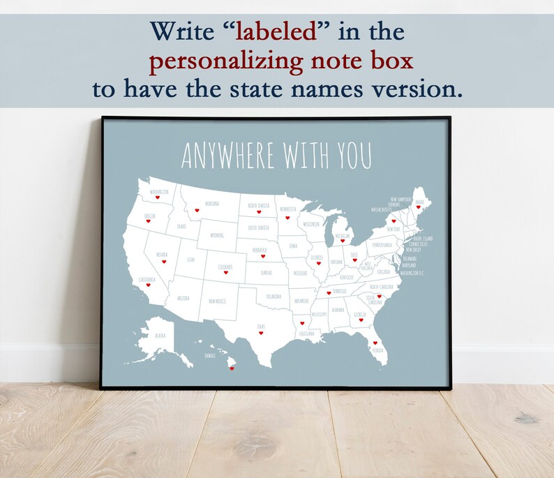 May include: A framed print featuring a map of the United States with red heart markers. The text "ANYWHERE WITH YOU" is above the map. The text at the top says "Write 'labeled' in the personalizing note box to have the state names version."