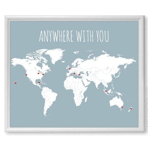 May include: A light blue world map print with the text "Anywhere with you" at the top. Red heart pins mark locations on the map.