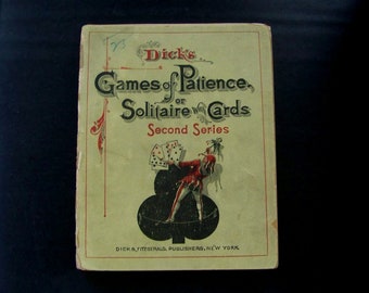 May include: A vintage book titled "Dick's Games of Patience or Solitaire with Cards, Second Series" with a black and white illustration of a jester holding playing cards.