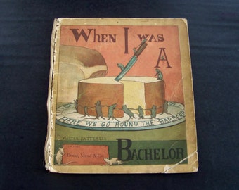 May include: A vintage book cover with the title "When I Was A Bachelor" and an illustration of mice pulling a piece of cheese.