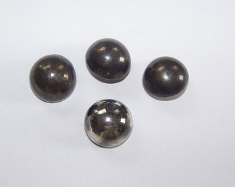 May include: Four round, silver-colored metal buttons with a smooth, shiny finish.