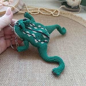 May include: A trio of ceramic mugs with a speckled, matte finish in cream, light grey, and dark grey. Each mug features a minimalist design and a rounded handle.