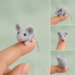 May include: A miniature needle-felted mouse figurine crafted from soft grey wool. The mouse features small black bead eyes, a light pink nose, and tiny pink paws. It has rounded ears and a long, thin tail, shown in various poses on a fingertip.