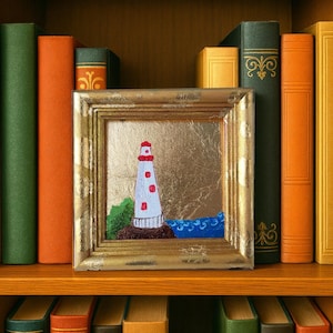 Lighthouse oil painting on gold leaf framed coastal wall art miniature seascape decor original nautical gift for ocean lovers