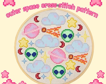 May include: A cross-stitch pattern featuring an outer space theme. The design includes planets, clouds, stars, aliens, and comets in pastel colors. The text "outer space cross-stitch pattern" is displayed above the design.