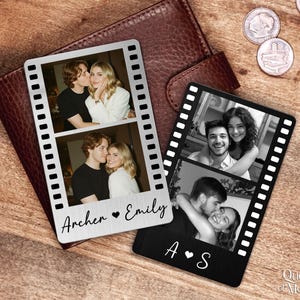 May include: Two film strip-shaped photo holders with black and white photos of couples. One is silver with the names "Archer ♥ Emily" and the other is black with the initials "A ♥ S". The items are on a brown leather wallet.