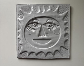 Carrelage en céramique soleil souriant