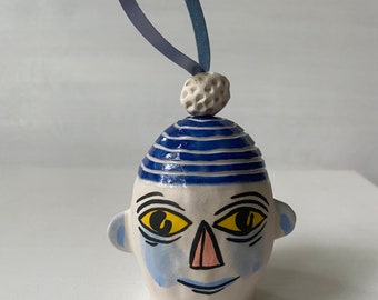 Porcelain  house plant ornament     Head with BLUE Pom-Pom hat