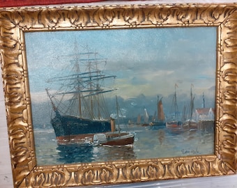 A late C19/ C20 English school oil painting of a seascape with moored sailing barges and a steam tug towing a three master.