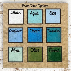 a collection of nine paint color options, each represented by a square with a different color. The options include white, aqua, sky, cornflower, ocean, turquoise, mint, olive, and forest.