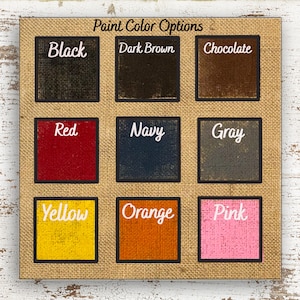 a collection of nine paint color options, each represented by a square with a different color. The options include Black, Dark Brown, Chocolate, Red, Navy, Gray, Yellow, Orange, Pink, and Yellow.